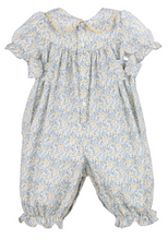 Load image into Gallery viewer, Introducing the Infant Girls Blue Snowberry Longall by Sophie &amp; Lucas—a charming one-piece silhouette in soft blue with golden yellow floral detailing. The scalloped collar and delicate side bow accents add refined feminine touches, while the coordinating print creates effortless occasion dressing for fall celebrations and family portraits. Pair with our big sister dresses for a perfectly matched look across siblings.
