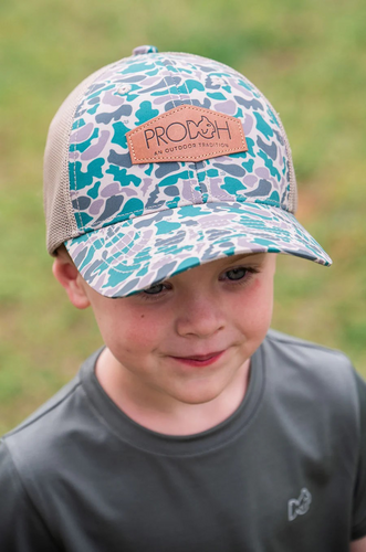 Blending in never looked so bold—the Kids Neutral Camo Trucker Hat brings outdoor tradition to everyday play. With its rugged camo pattern, breathable mesh back, and faux-leather patch, this cap is made for kids who are always up for an adventure.