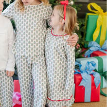 Load image into Gallery viewer, Dress your little one in cozy holiday charm with the Carlin Girls&#39; Lounge Dress from Lila &amp; Hayes. Crafted from soft pima cotton, this long-sleeve dress features a delicate flutter ruffle hem and playful pom pom trim that add festive flair. The whimsical Christmas tree print captures the magic of the season, while the button closure at the back ensures easy dressing. Perfect for lounging or holiday gatherings, this dress combines comfort with joyful style for memorable celebrations.
