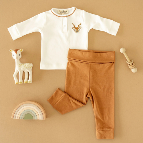 Dress your little one in the Luna & Arlo Buckhead 2pc Pant Set for unmatched comfort and style. Crafted from 100% luxurious Pima Cotton, this soft, breathable fabric keeps delicate skin happy all day long. The set features a cozy fit that moves with your child, while the hand-embroidered buckhead on the top adds a charming, artisanal detail. Perfect for playdates or quiet moments, this two-piece offers both comfort and a unique touch that stands out.