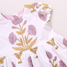 Load image into Gallery viewer, Peek A Boo! Oversized wild dandelions bloom against a 100% cotton vintage cotton voile on our extra special Girls Marisol Dress. Full of surprises, this short sleeve vintage-inspired piece has a purple lining peeking out from behind the scalloped hem and a set of sparkly glitter buttons at the back. 
