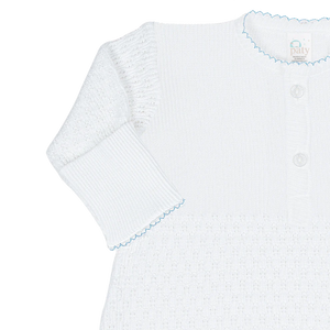 Celebrate your newborn’s arrival with the Infant Knit Placket Gown by Paty. Crafted from a soft 50/50 knit blend in classic white, this gown features delicate light blue or pink picot trim and signature Paty buttons for a charming finish. Available in Newborn and Preemie sizes, it offers a cozy, gentle fit that keeps your baby comfortable while looking adorable. Perfect for those first precious moments.