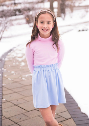 The Teagan Turtleneck from James and Lottie's Basics Collection is a timeless addition to any wardrobe. Versatile and stylish, it can be paired with a variety of outfits for any occasion. Perfect for those looking for a classic turtleneck with a modern twist.