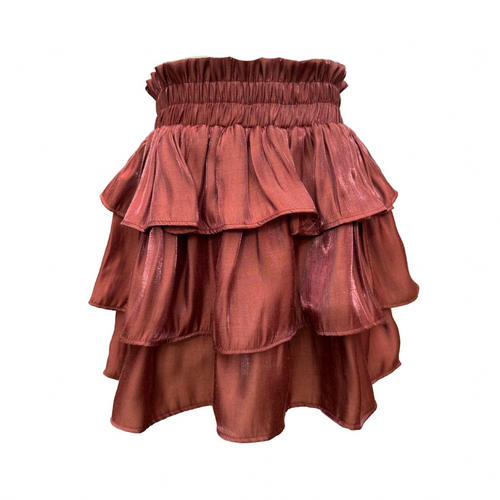 The Luna Skirt in Chestnut Shimmer from Pleat offers a dazzling tiered design that adds sparkle to every step. Perfectly crafted for tween girls, this skirt pairs effortlessly with the striped Oliva Flutter Top or Wren Top in Dashing, creating a stylish and versatile outfit. Its shimmering fabric makes it ideal for special occasions or everyday wear, giving your child a confident and playful look.