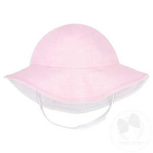 Our girls hat features an adjustable chin strap with an ultra-soft fastener and reverses to a solid white for maximum versatility. An Add-A-Bow slot lets you accessorize with your favorite Wee Ones bow (bow sold separately). UPF 50+ provides protection from the sun. 100% cotton.