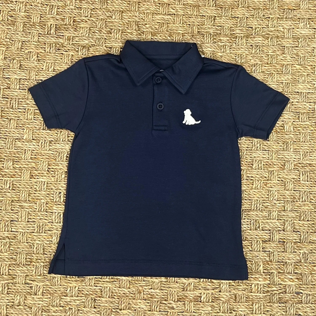 Get your son ready for Summer with this Boys Navy Polo featuring a cute white puppy logo from James & Lottie. Made for boys of all ages, it pairs perfectly with any shorts for a stylish and adorable outfit. Perfect for any Summer celebration or casual day out!