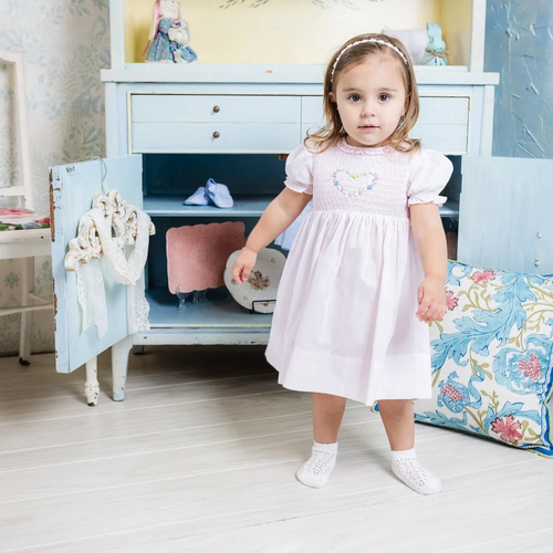 Looking for that perfect baby girl dress for this spring? Intricate smocking and embroidery is all hand-stitched for an heirloom quality piece. Made of easy, breezy woven cotton blend for those beautiful spring days. 