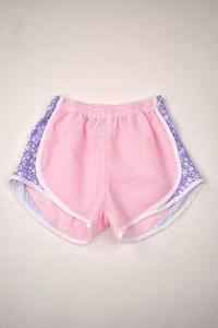 Upgrade your little girl's athletic wardrobe with our Pink Gingham &amp; Lavender Track Shorts from Funtasia Too! These stylish pin shorts feature a beautiful lavender floral accent on the sides, adding a touch of feminine charm to her sporty look. Perfect for pairing with the Angel Tee!