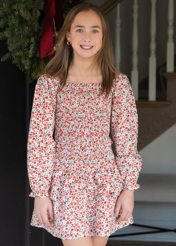 Celebrate the season in timeless style with this Girls Christmas Floral Smocked Dress from Be Elizabeth. Featuring delicate holiday florals and charming smocked detailing, this tween dress strikes the perfect balance between festive and versatile. The classic silhouette appeals to both moms and their growing girls, making it an ideal choice for holiday gatherings, family photos, and special occasions throughout the year. 