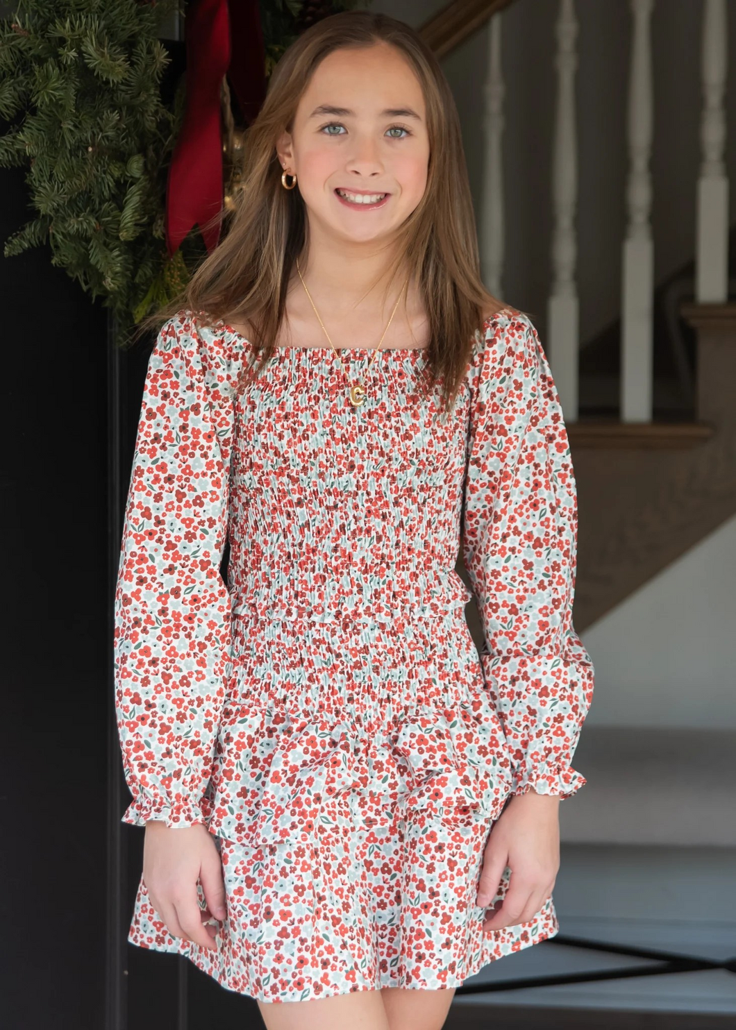 Celebrate the season in timeless style with this Girls Christmas Floral Smocked Dress from Be Elizabeth. Featuring delicate holiday florals and charming smocked detailing, this tween dress strikes the perfect balance between festive and versatile. The classic silhouette appeals to both moms and their growing girls, making it an ideal choice for holiday gatherings, family photos, and special occasions throughout the year. 