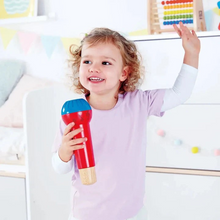 Load image into Gallery viewer, The Mighty Echo Microphone is perfect for children aged 12 months and up who love to sing and perform. This battery-free toy adds a fun echo effect to any voice, inspiring creativity without the need for power. Its vibrant primary colors and musical note design make it an eye-catching accessory for solo performances or group play. Let your little one unleash their inner pop star and enjoy endless musical fun with the Mighty Echo Microphone.
