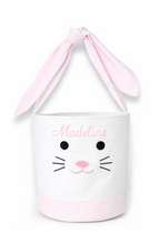 Load image into Gallery viewer, Celebrate the magic of springtime with a seersucker-trimmed Bunny Basket made for egg-hunting, Sunday morning surprises, and all of the excitement that the holiday has in store. With bunny ear straps and sweet bunny face embroidery, these large cotton totes are constructed of soft stone canvas and pastel seersucker and can be customized with a name for that extra special added detail.

Easter Bunny-approved bunny face embroidery ready for springtime celebrations
Perfect for kids of all ages
Great for holida

