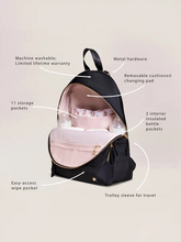 Load image into Gallery viewer, Everyone needs a trusty, everyday bag, and the Everyday Backpack from JuJuBe is here to be just that

Machine washable
11 pockets, including 2 insulated bottle pockets
Travel made easy with a trolley sleeve and removable stroller straps
Comfortable, adjustable shoulder straps
Removable stroller straps
Cushioned changing pad
