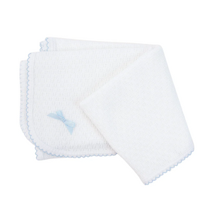 Wrap your little one in the soft embrace of the Knit Receiving Blanket with Bow from Paty. Featuring charming blue or pink trim accented by coordinating bows, this beloved knit blanket blends comfort with classic style. Perfect as a thoughtful gift for any new arrival, it offers gentle warmth and a touch of elegance that parents will appreciate. Make every cuddle special with this timeless essential.