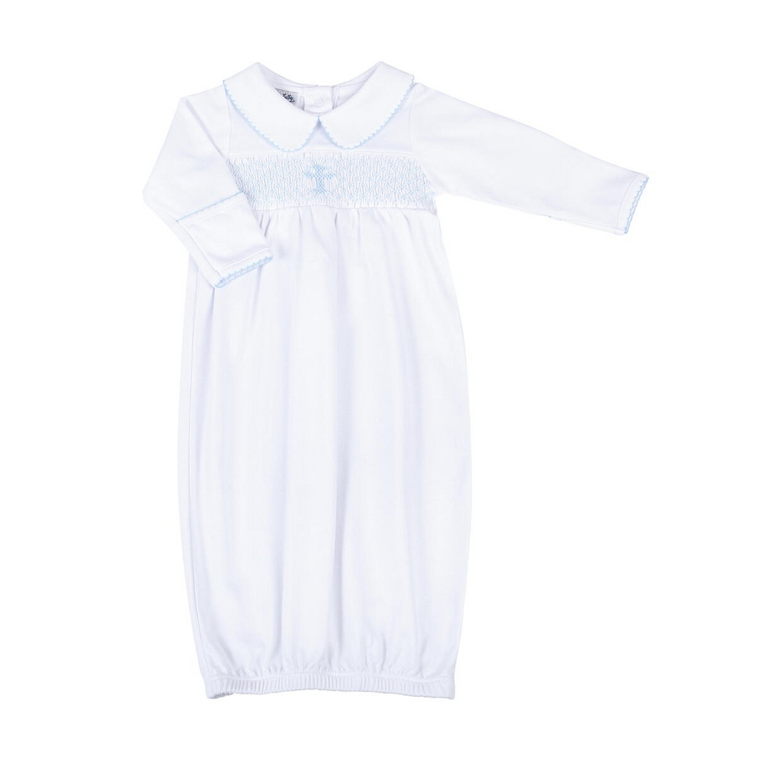 Dress your little girl in divine style with our Blessed Blue Smocked Collared Gown from Magnolia Baby. This infant gown features a delicate collar with enchanting embellishments and smocked detailing on the chest, including a sweet blue cross. Give your little angel a blessed look on any occasion.