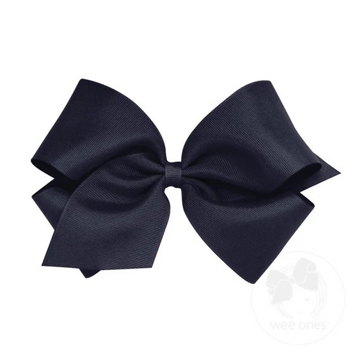 Make a bold statement with the King Classic Grosgrain Hair Bow from Wee Ones in Navy. Designed as the perfect standout accessory, this large bow measures approximately 6.25” x 5” with a 2.25” ribbon, ensuring it catches every eye. Featuring the patented WeeStay™ no-slip clip, it stays securely in place all day, no matter the activity. Available in a wide range of colors, this bow is ideal for any little girl who loves to add a touch of charm and confidence to her outfit every day.