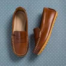 Load image into Gallery viewer, The Alex Driver combines sporty comfort and polished chic for your little boy. Crafted from premium leather and lined with natural sheepskin, these shoes offer softness, protection, and moisture absorption. The lightweight, flexible rubber outsole ensures durability. Cushioned insoles made from recycled leather and Bontex add support. Featuring a diamond-shaped cutout and hand-sewn stitching, these shoes are perfect for any occasion. Made in Peru with fair trade practices, they ensure ethical craftsmanship.
