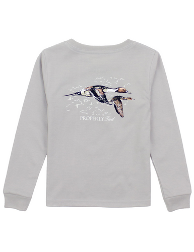 Made from 100% Pima cotton, the Boys Long Sleeve Pintails Signature Tee is perfect for everyday wear, combining soft comfort and durability. The long sleeve tee features hand-drawn graphics that stay vibrant wash after wash, plus a front pocket with our iconic duck logo that adds a touch of personality. 