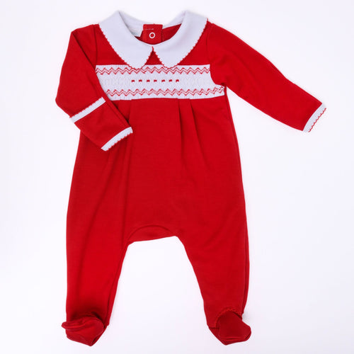 Dress your little one in timeless holiday charm with the Christmas Classics Smocked Boy Footie by Magnolia Baby. Crafted from soft, breathable pima cotton, this red footie features a delicate smocked bodice and a classic Peter Pan collar, creating an elegant yet cozy look. Perfect for welcoming your new arrival into the festive season, it combines comfort and style effortlessly for unforgettable holiday memories.