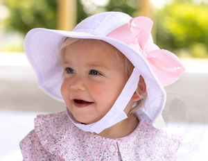 Our girls hat features an adjustable chin strap with an ultra-soft fastener and reverses to a solid white for maximum versatility. An Add-A-Bow slot lets you accessorize with your favorite Wee Ones bow (bow sold separately). UPF 50+ provides protection from the sun. 100% cotton.