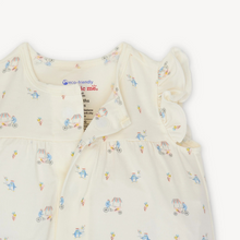Load image into Gallery viewer, The Penguin Pints Ruffle Sleeve Romper from Magnetic Me combines adorable style with effortless functionality. Crafted from eco-friendly TENCEL™ modal, this romper is silky soft, breathable, and temperature-regulating, ensuring your little one stays comfortable all day. SewSafe™ magnetic closures along the front allow quick, stress-free dressing and changing, perfect for busy parents. Ideal for warm weather, this romper offers a cozy fit with charming ruffle sleeves that add a playful touch to your infant’s
