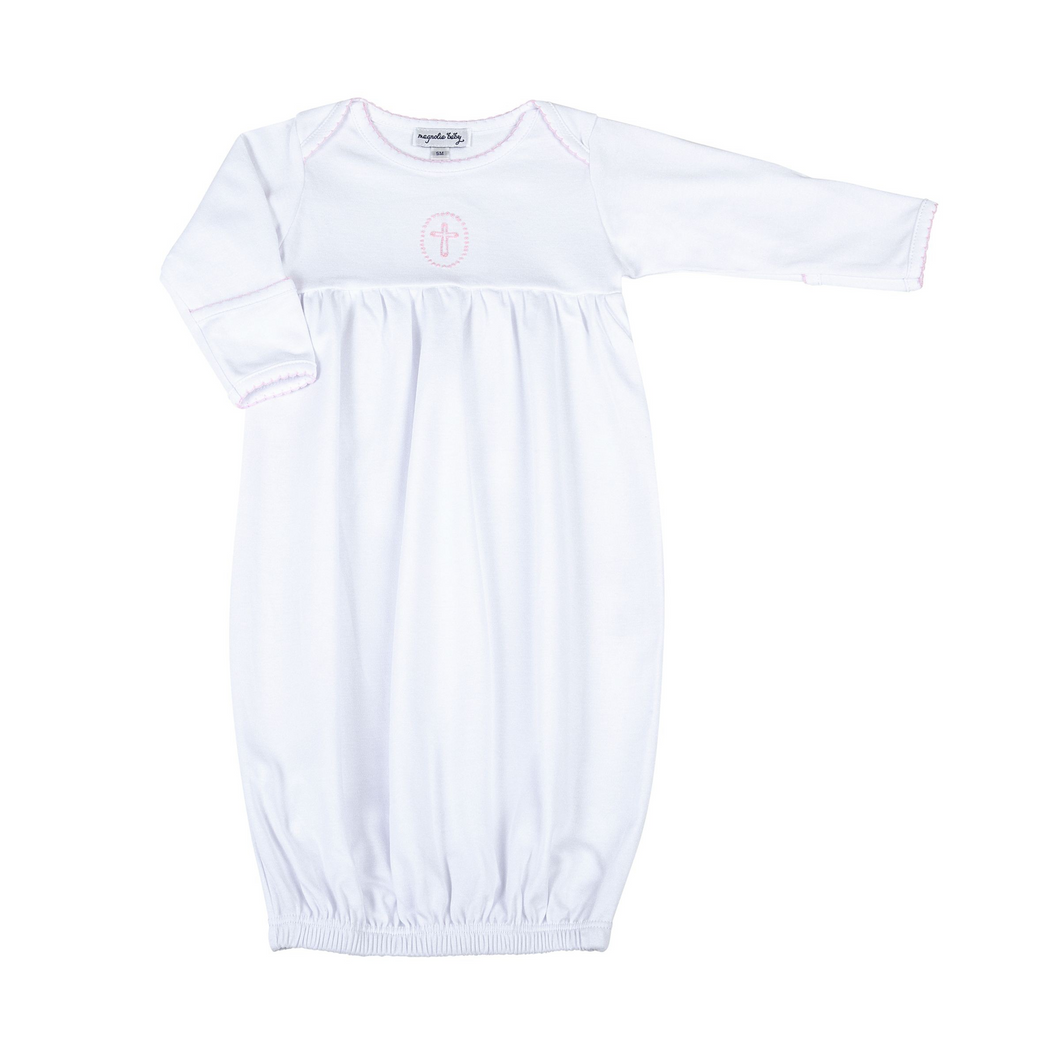 Welcome your little bundle of joy into the world with our Blessed Pink Smocked Gown. Crafted from the softest materials, this gown features a delicate cross stitched in the center of the chest and intricate embroidery on the neckline and sleeves. This simple yet elegant design is sure to become a cherished keepsake for years to come.