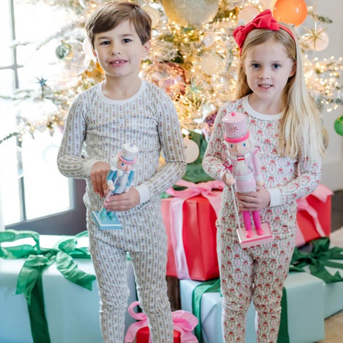 Experience cozy comfort with the Bradford Boys' Pajama Pant Set from Lila & Hayes. Crafted from 100% soft Peruvian Pima cotton, this long-sleeved top and elastic-waist pant set offers a snug, safe fit without flame retardants. The top features a charming pocket with white piping, while the nutcracker stripe adds classic style. Designed with care, these pajamas ensure both comfort and peace of mind for your little one’s bedtime.