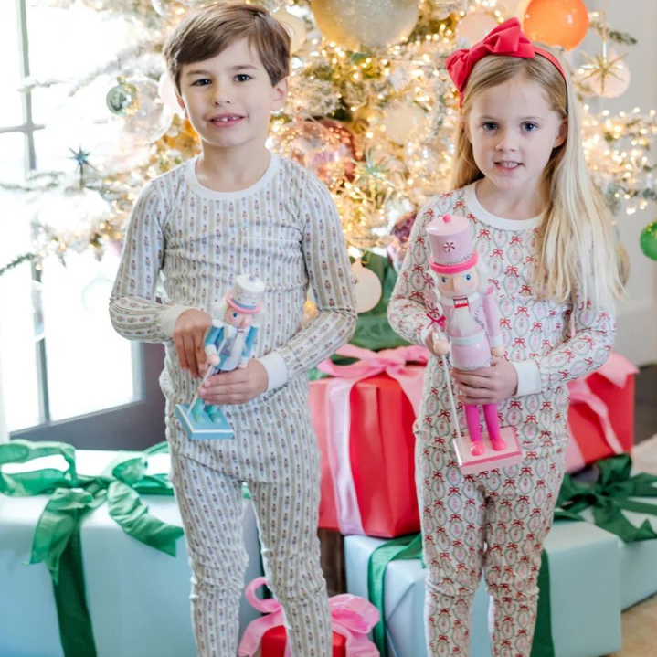 Experience cozy comfort with the Bradford Boys' Pajama Pant Set from Lila & Hayes. Crafted from 100% soft Peruvian Pima cotton, this long-sleeved top and elastic-waist pant set offers a snug, safe fit without flame retardants. The top features a charming pocket with white piping, while the nutcracker stripe adds classic style. Designed with care, these pajamas ensure both comfort and peace of mind for your little one’s bedtime.