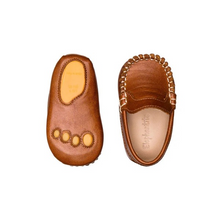 Load image into Gallery viewer, The Elephantito Baby Moccasin epitomizes luxury and craftsmanship in baby footwear. Expertly crafted with fine, full-grain leather uppers and hand-stitching, this moccasin is a work of art. Every detail, from the brogue leather tongue to the signature &quot;paw&quot; design stamped on the leather sole, has been carefully considered. Designed for comfort and practicality, the cushioned footbeds support your baby&#39;s developing feet, while the absorbent leather lining keeps them dry and comfortable. The slip-on design en
