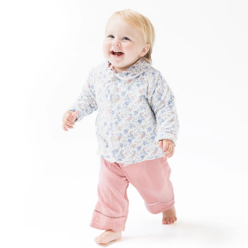 This Country Girl Floral Quilted Jacket with a charming Peter Pan collar is crafted from soft, heavyweight bamboo fabric, providing warmth and comfort for infants and toddlers. Its quilted design adds cozy insulation, making it ideal for crisp fall days. Pair it effortlessly with leggings or a skirt to create an adorable, stylish outfit your little one will love to wear.
