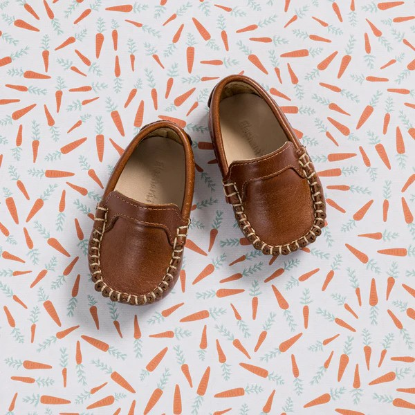 The Elephantito Baby Moccasin epitomizes luxury and craftsmanship in baby footwear. Expertly crafted with fine, full-grain leather uppers and hand-stitching, this moccasin is a work of art. Every detail, from the brogue leather tongue to the signature 