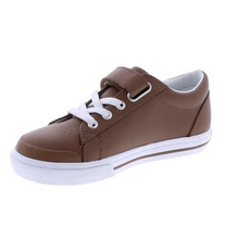 Load image into Gallery viewer, Footmates Reese Brown Leather Sneaker- Leather blucher oxford vulcanized sneaker featuring hook-and-loop closure and decorative elasticized false-laces.
Custom Fit System – Removable,&nbsp;dual&nbsp;insoles in Medium and Wide provided for customized fitting.
Roomy Toe Box – Allows tiny toes room to breathe and splay naturally during walking, enhancing balance and reducing rubbing, friction, and moisture.
Arch Support – Shoe last and insole designed to provide proper arch support for developing feet.
Firm He
