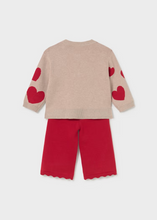 Load image into Gallery viewer, Cozy knit sweater and pants set from Mayoral featuring a playful hearts design. The soft, lightweight sweater pairs perfectly with coordinating pants for an effortless outfit that transitions from playtime to special occasions. Ideal for layering on cool fall and winter days, this two-piece set offers comfort and style in one coordinated look.
