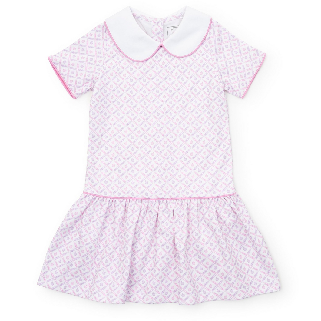 The Girl's School Plaid Pink Libby Dress by Lila & Hayes combines classic charm with playful details. Featuring a pink and purple crayon and apple pattern, complemented by a crisp white Peter Pan collar and a stylish dropped waist, this dress is perfect for back-to-school days. Its vibrant colors and timeless design make it a favorite choice for your little girl’s wardrobe, blending comfort and style effortlessly.