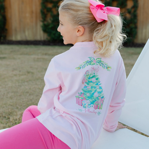 With its charming Santa Tree design, this girls pink long sleeved t shirt will make you look festive. Because it is composed of warm and breathable cotton, it is ideal for cold days that are full of joyous celebrations. This t-shirt adds charm and coziness to any gathering, whether it's a family get together or a classroom party.
