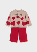 Load image into Gallery viewer, Cozy knit sweater and pants set from Mayoral featuring a playful hearts design. The soft, lightweight sweater pairs perfectly with coordinating pants for an effortless outfit that transitions from playtime to special occasions. Ideal for layering on cool fall and winter days, this two-piece set offers comfort and style in one coordinated look.
