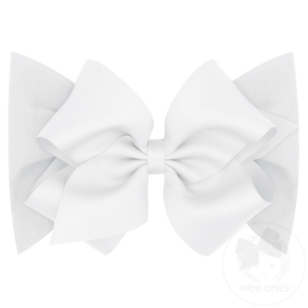 Our small king classic grosgrain bow is now perfect for baby with our matching soft cotton jersey band. Available in light pink and white.
Approximate Size: 5.5” x 4” (2.25” Ribbon)