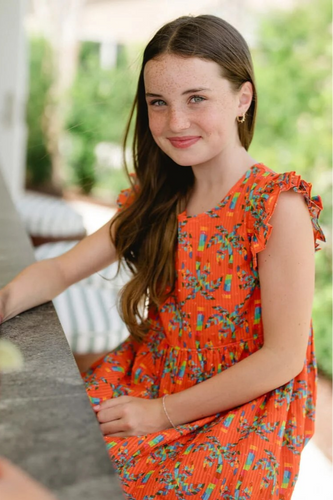 This Girl's Logal Dress from Briton COurt is a vibrant and fun floral print for summer or a tropical vacation. SHe can be transported away straight to the tropics for any event. SUch a fun and bold dress for any girls this season.