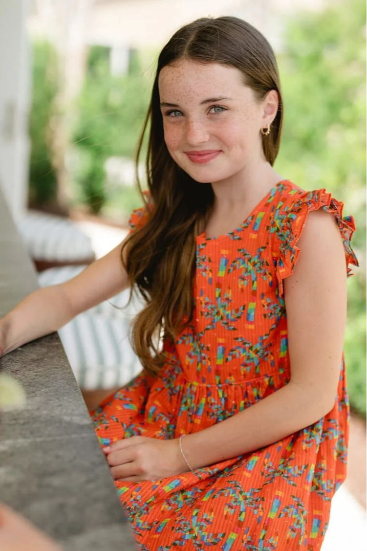 This Girl's Logal Dress from Briton COurt is a vibrant and fun floral print for summer or a tropical vacation. SHe can be transported away straight to the tropics for any event. SUch a fun and bold dress for any girls this season.