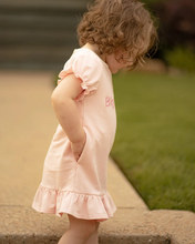 Load image into Gallery viewer, A sweet dress for the most precious Big Sister announcement! Ultra comfortable knit fabric with princess sleeves with elastic cuffs, crew neck with single button back closure. Fun ruffled dress hem. Custom bow and big sister embroidery on chest. Polyester spandex blend knit.
