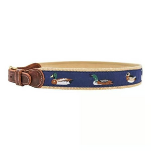 Elevate your boy’s style with the Water Fowl Boys Belt by J. Bailey. This woven belt showcases charming nylon water fowl patterns against a navy background, paired with a sleek leather and gold closure for a timeless look. Perfect for adding a classic touch to any outfit, it’s a durable and stylish accessory designed to complement your young gentleman’s wardrobe effortlessly.