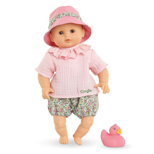 Splash into a beautiful new friendship! Dressed in a cotton gauze T-shirt, flowery bloomers, and a matching pink hat, this adorable doll is ready for a full day of fun in the sun AND water. Get sudsed up in the bath (soapy water), dive into the pool (chlorinated water), ride the waves at the beach (saltwater) - this doll can handle it all!

Meanwhile, the soft body is wonderfully huggable, the vinyl face, arms, and legs are delicately scented with vanilla, and the eyes shut when you lay it down. Plus, there