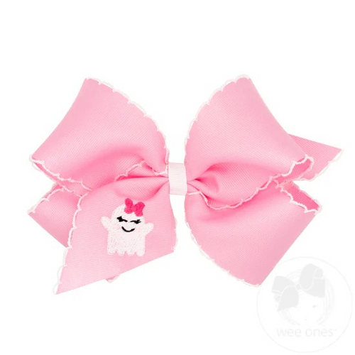 King Grosgrain Hair Bow with Moonstitch Edge and Pink Ghost Embroidery. Features a cute bow wearing ghost on the ribbon. Pairs with our Halloween pink looks this season! From Wee Ones.