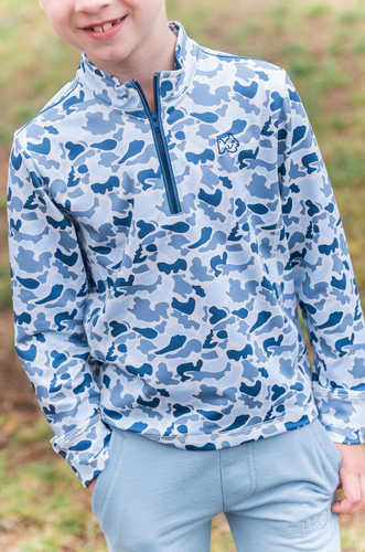 The Boys Pro Performance Blue Camo Pullover by Prodoh combines style and function with its bold blue camo print and durable performance fabric. Designed for toddlers to tween boys, this 1/4 zip pullover offers easy layering and exceptional comfort during active play. Perfect for year-round wear, it helps keep your young one warm without overheating, making it an essential addition to any kid’s wardrobe.