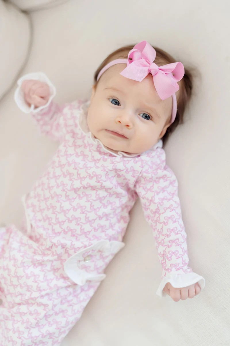 Dress your little one in charming comfort with the Infant Girls' Lucy Romper from Lila & Hayes. This footed romper features delicate pink bow prints and sweet ruffle accents, creating an adorable outfit that’s perfect for playtime or naptime. Designed to match the big sister lounge dress and robe, it’s ideal for coordinated family moments while keeping your baby cozy and stylish all day long.