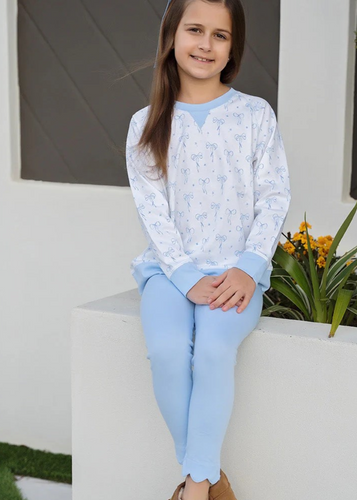 These Blue Scallop Leggings are a charming addition to any girl's wardrobe, perfectly complementing the Sidney Blue Bows Knit Sweatshirt for a stylish, coordinated outfit. Their versatile design makes them easy to pair with a variety of tops, offering comfort and a touch of playful elegance for everyday wear.