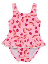 Load image into Gallery viewer, Transform your little one into a fashionable and sweet summer dream with our Berry Sweet Skirt Swimsuit! This charming one-piece combines a fun watermelon print with delicate frill skirt and mini white pompom edges. With a self-fabric tie at the back, it offers a comfortable and stylish fit for endless poolside fun and frolicking in the sun. From SnapperRock for toddler and infant girls.
