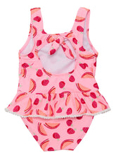 Load image into Gallery viewer, Transform your little one into a fashionable and sweet summer dream with our Berry Sweet Skirt Swimsuit! This charming one-piece combines a fun watermelon print with delicate frill skirt and mini white pompom edges. With a self-fabric tie at the back, it offers a comfortable and stylish fit for endless poolside fun and frolicking in the sun. From SnapperRock for toddler and infant girls.
