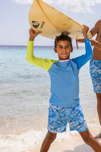 Load image into Gallery viewer, Introduce your toddler boy to the joys of water play with this vibrant color-block rash guard swim top. Featuring a light blue body, blue and citron sleeves, and a white collar, this top is both stylish and functional. Designed by SnapperRock, this top offers sun protection while allowing for full range of motion. Complete the look with the matching Citron Swim Shorts for endless adventures in the sun!
