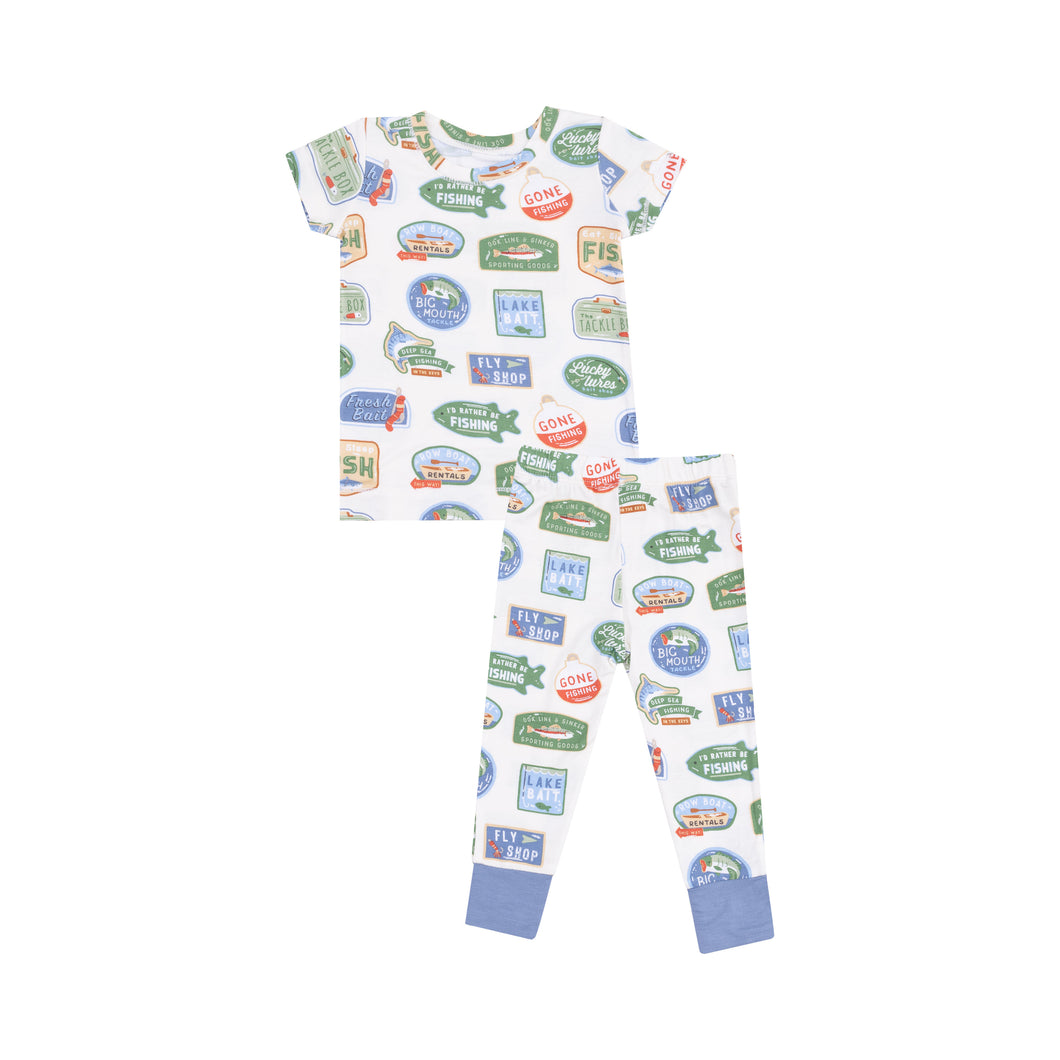 Get your little angler ready for bed in style with the Boys Bait Shop Loungewear Set from Angel Dear. Made with soft bamboo fabric, this favorite pajama set features colorful bait shop and fishing sign prints. Perfect for infant and toddler boys, this set will keep your little one comfortable all night long.